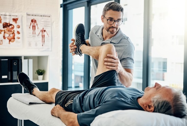 A physiotherapist with a patient